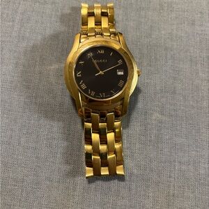 Gucci Luxurious Gold and Black Timepiece